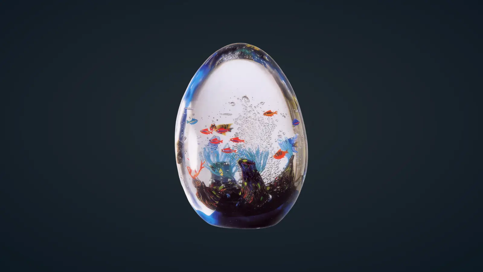 Egg-shaped Murano crystal aquarium with colourful fish